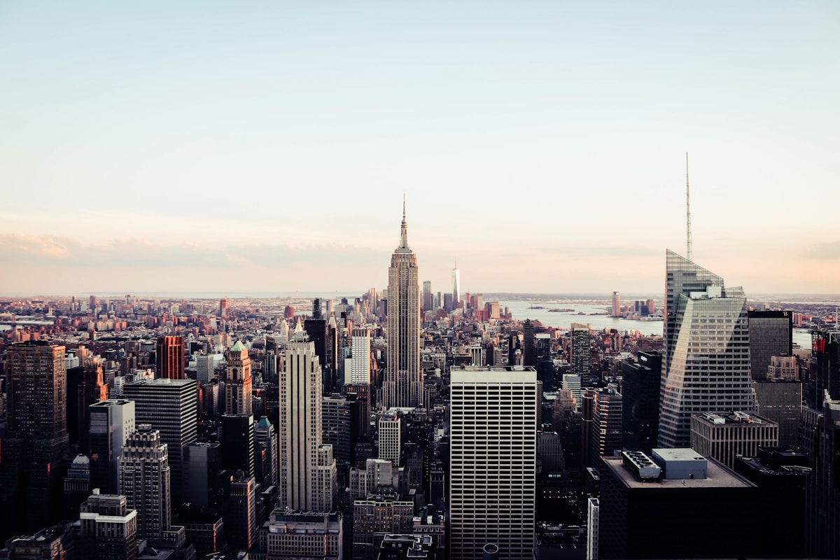 Manhattan skyline with Empire State Building and skyscrapers at dusk